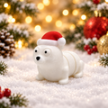 White articulated polar bear Christmas fidget wearing a red Santa hat