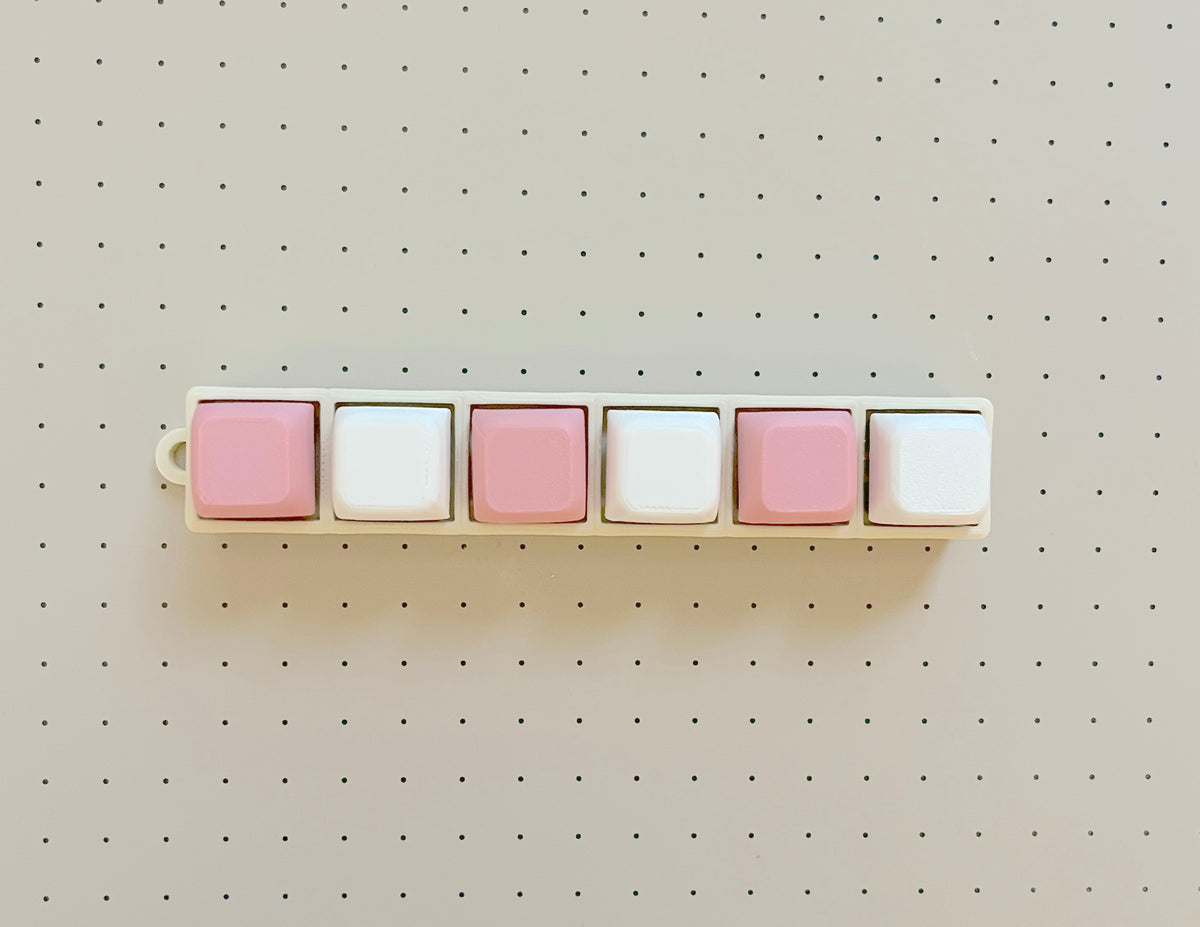 Six-cap single row clicker